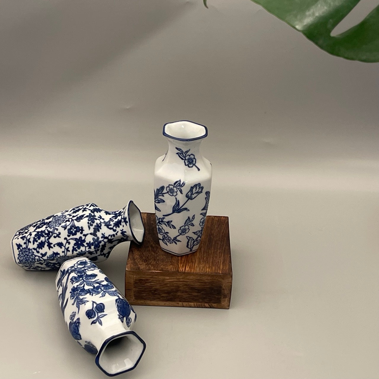 Set of 2 porcelain vases for your home decor. Available in a set of subdued leaf print. Perfect for gifting or your own corner
