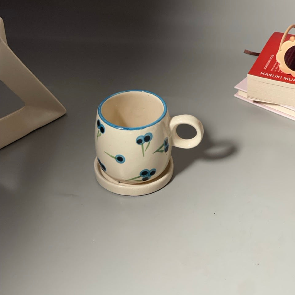 Berry print ceramic mug with versatile saucer in blueberry and yellowberry prints