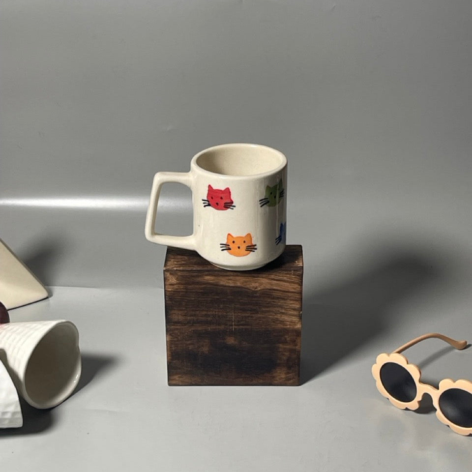 Ceramic milk mugs with cat print design, ideal for cozy drinks