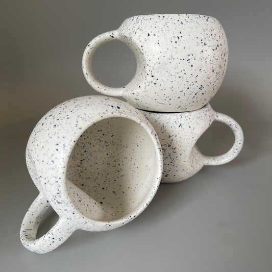 Handmade ceramic mugs available in a unique Apple shaped cup with blue dots as a set of 2