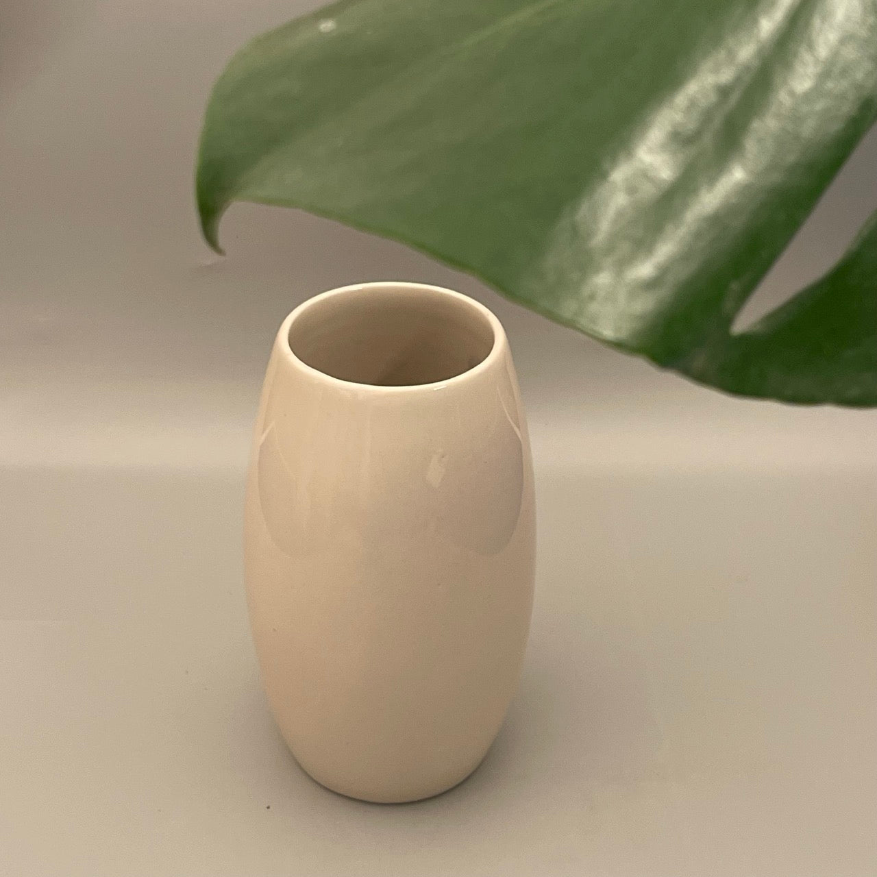 Medium ceramic vase with a drum-inspired shape and wide open mouth