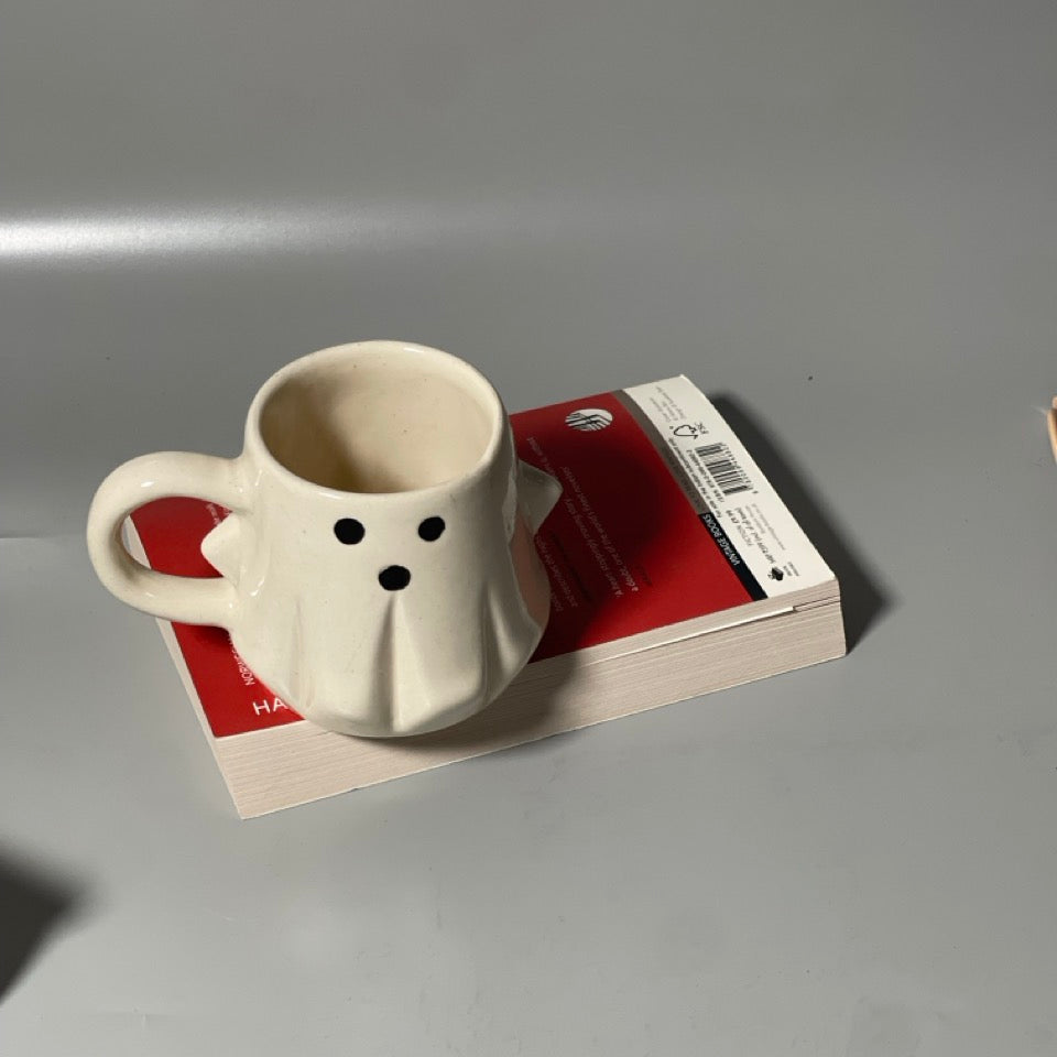 Medium-sized ghost-shaped ceramic mug ideal for Halloween or everyday cozy drinks