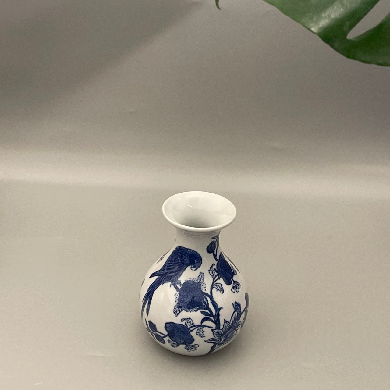 Handcrafted Chinese pottery vase with parrot and foliage design – elegant statement decor for home interiors