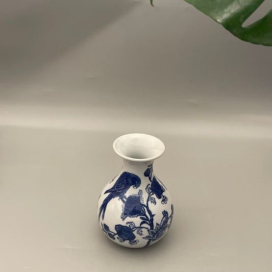 Handcrafted Chinese pottery vase with parrot and foliage design – elegant statement decor for home interiors