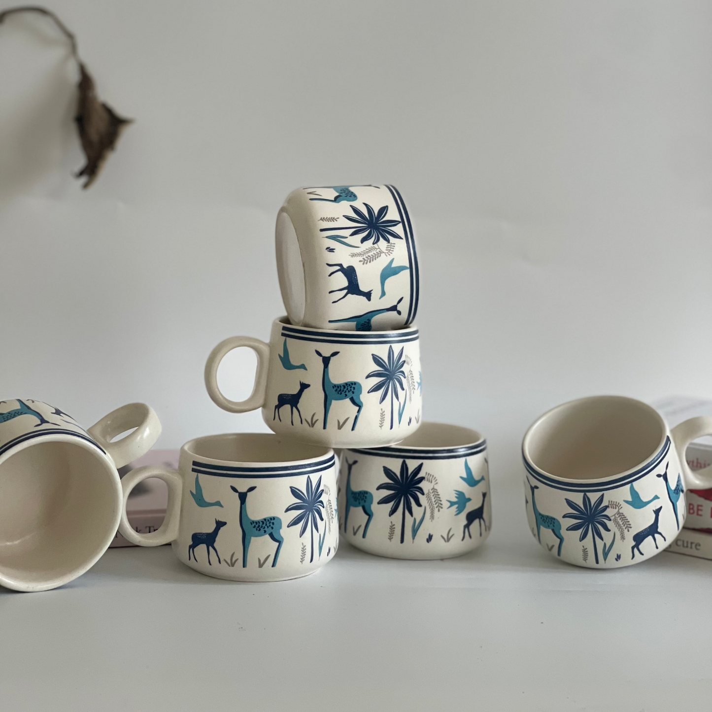Sips of Nature ceramic tea cup set of 6 with assorted designs featuring deer, leaves, and nature motifs in earthy tones
