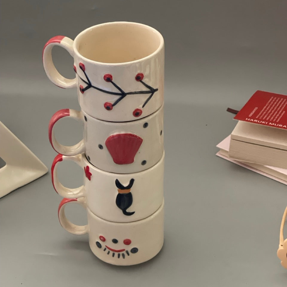 Stackable ceramic cup set of 5 with shell, branch, dog, eyelash and lips motifs