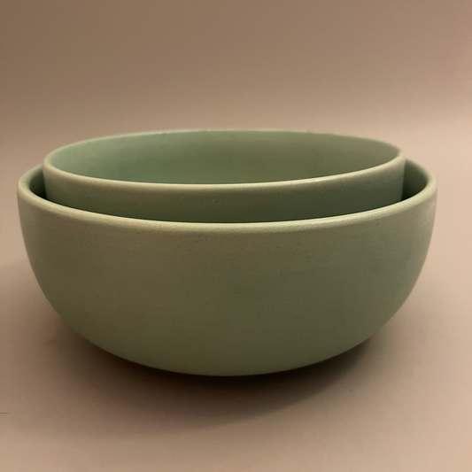 Teal Team Serve BowlsSet of 2 matte teal ceramic serve bowls in 8.5 and 7.5 inch sizes, ideal for salads, dals, or sabzis