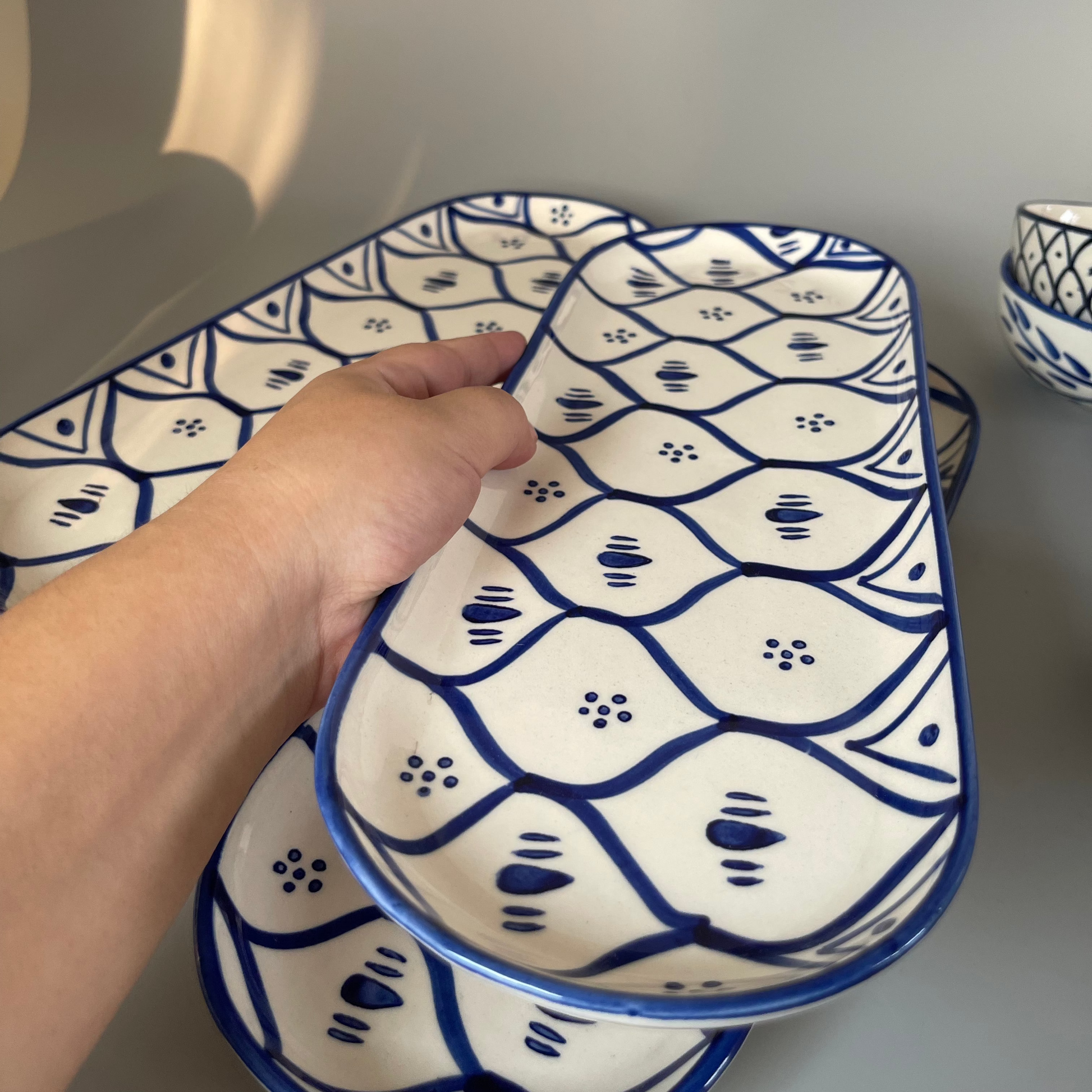Ceramic platter with tribal-inspired patterns, ideal for serving salads, starters, or festive meals