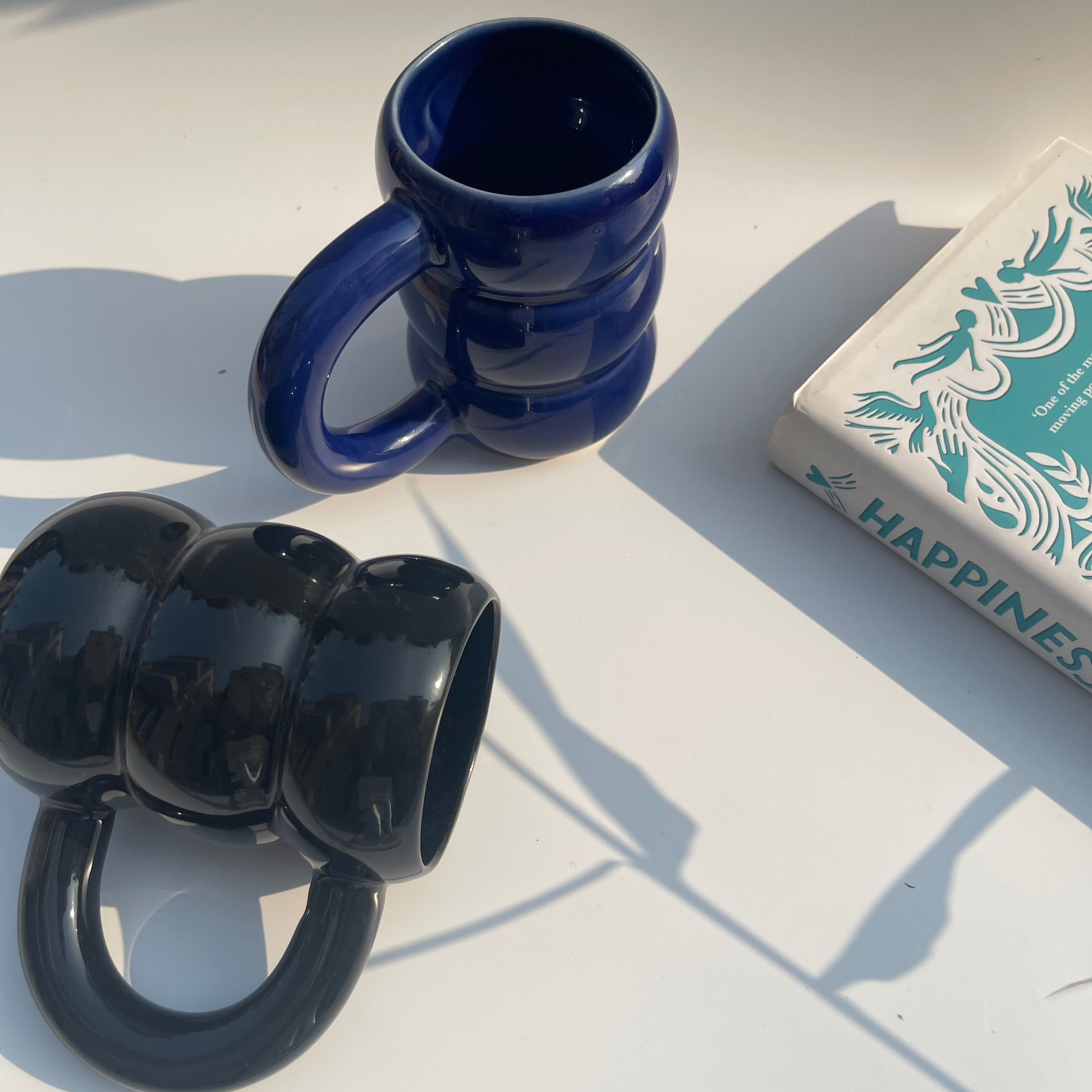 Set of 2 ceramic mugs in deep black and blue tones – perfect for tea, coffee, or gifting
