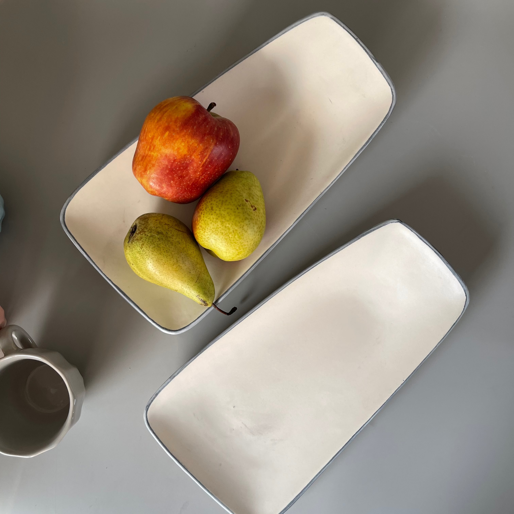 White ceramic platter with classic blue rim, ideal for serving snacks or desserts at casual or festive occasions