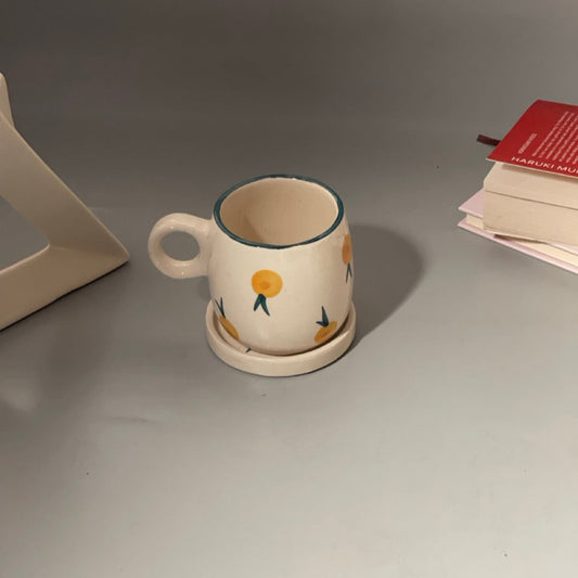 Berry print ceramic mug with versatile saucer in blueberry and yellowberry prints