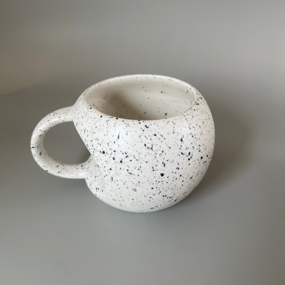 Handmade ceramic mugs and saucer available in a unique Apple shaped cup with blue dots while the saucer can be used as an accompaniment with the cup or a standalone dessert plate