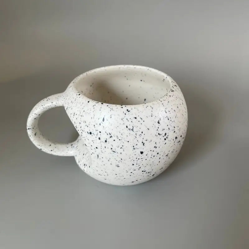Speckled Apple ceramic mug on a plain background