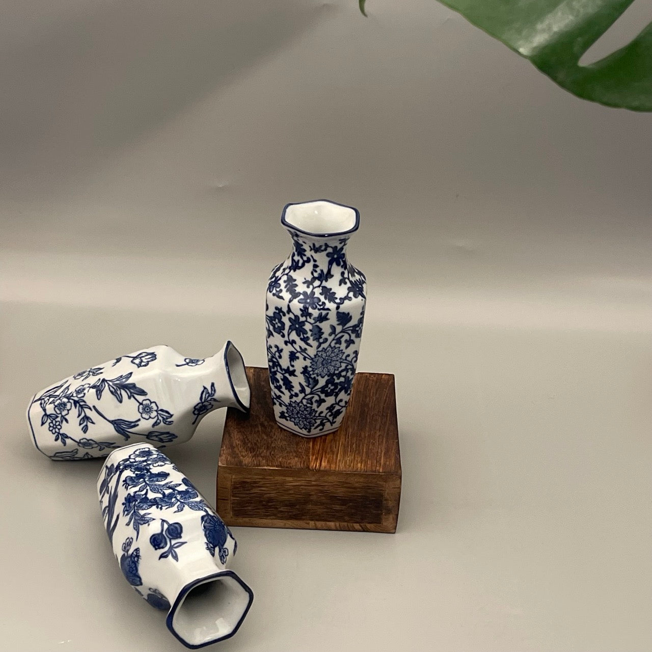 Set of 2 porcelain vases for your home decor. Available in a set of subdued leaf print. Perfect for gifting or your own corner