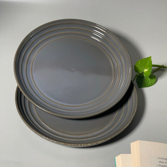 Top view of the Blue Ribbed qaurter plate that adds personality with its gold ribbed rims