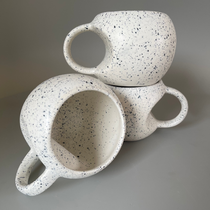 Handmade ceramic mugs available in a unique Apple shaped cup with blue dots as a set of 2
