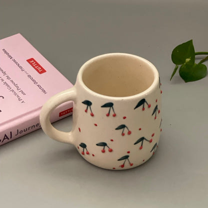 Set of two ceramic mugs with heart and cherry prints in Pinterest-inspired design