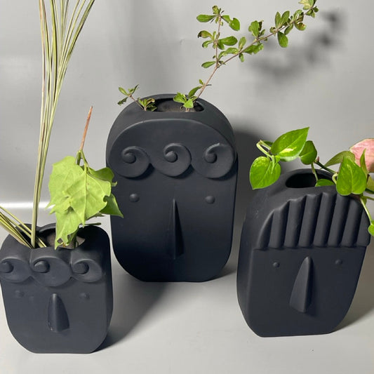 Set of 3 ceramic face print vases in matte finish, sizes XS to M, abstract modern design
