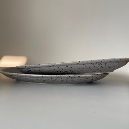 Grey speckled ceramic platter with earthy finish for serving appetisers or festive snacks – rustic and minimal style
