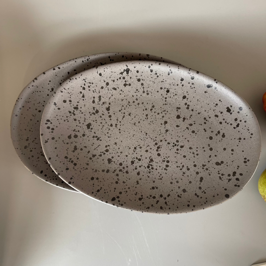 Grey speckled ceramic platter with earthy finish for serving appetisers or festive snacks – rustic and minimal style