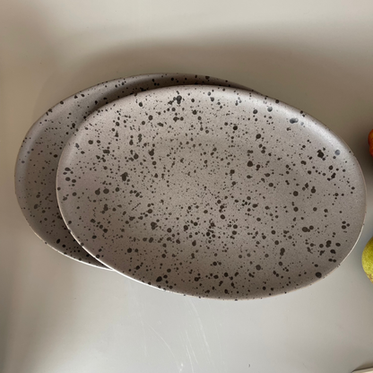 Grey speckled ceramic platter with earthy finish for serving appetisers or festive snacks – rustic and minimal style