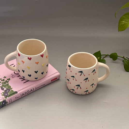 Set of two ceramic mugs with heart and cherry prints in Pinterest-inspired design