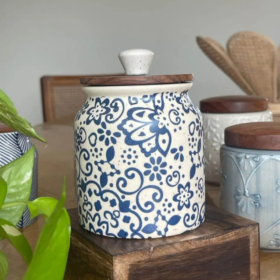 Ceramic Keepsake jar with blue floral decal pattern on a wooden surface