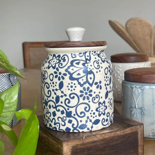 Ceramic Keepsake jar with blue floral decal pattern on a wooden surface