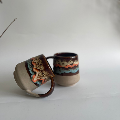 Mountain Moods ceramic mug with volcanic, ocean, and clay-inspired hand-glazed finish
