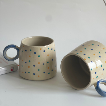Large ceramic mugs with round orbit handle, available in green-black and white with dotted colors