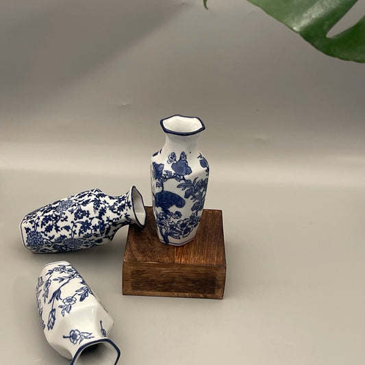 Set of 2 porcelain vases for your home decor. Available in a set of subdued leaf print. Perfect for gifting or your own corner