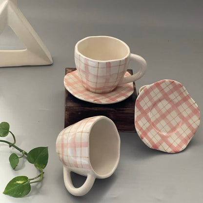 Pinterest-inspired pink checkered ceramic cup with matching saucer