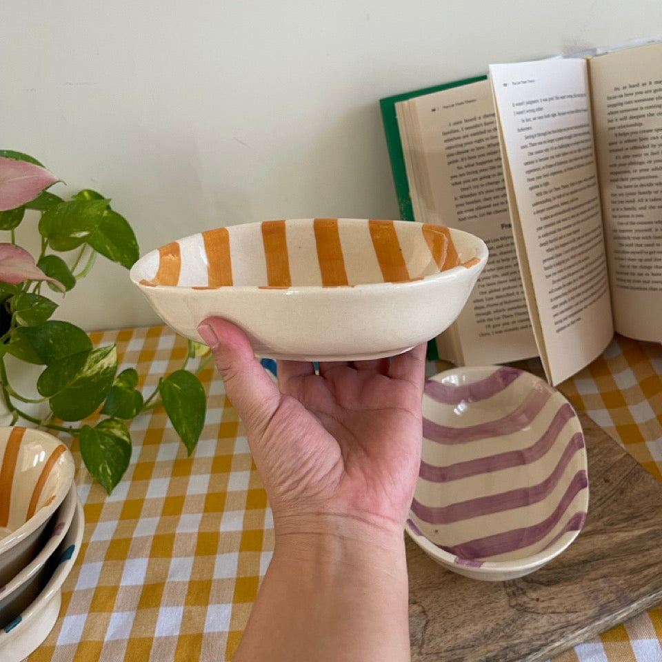 Yellow striped snack bowls on a table. Perfect for snacking or serving