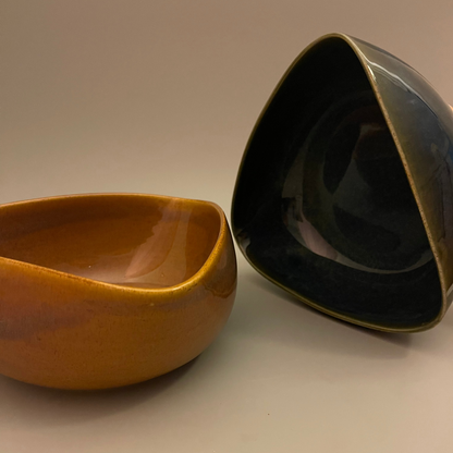 Set of uniquely shaped ceramic serve bowls in deep blue and brown tones, ideal for dips, sides, or snacks