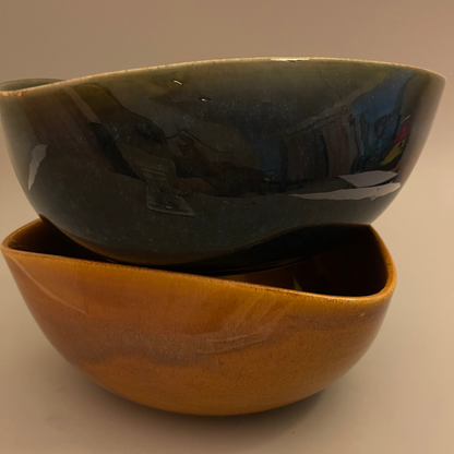 Set of uniquely shaped ceramic serve bowls in deep blue and brown tones, ideal for dips, sides, or snacks