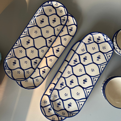 Ceramic platter with tribal-inspired patterns, ideal for serving salads, starters, or festive meals