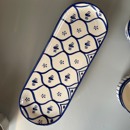 Ceramic platter with tribal-inspired patterns, ideal for serving salads, starters, or festive meals