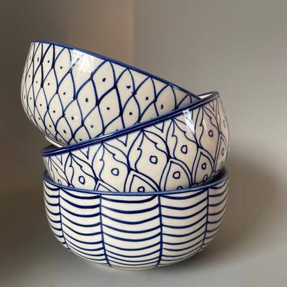 7.5 inch ceramic bowls with tribal-inspired leaf, fish, and wave prints in earthy tones