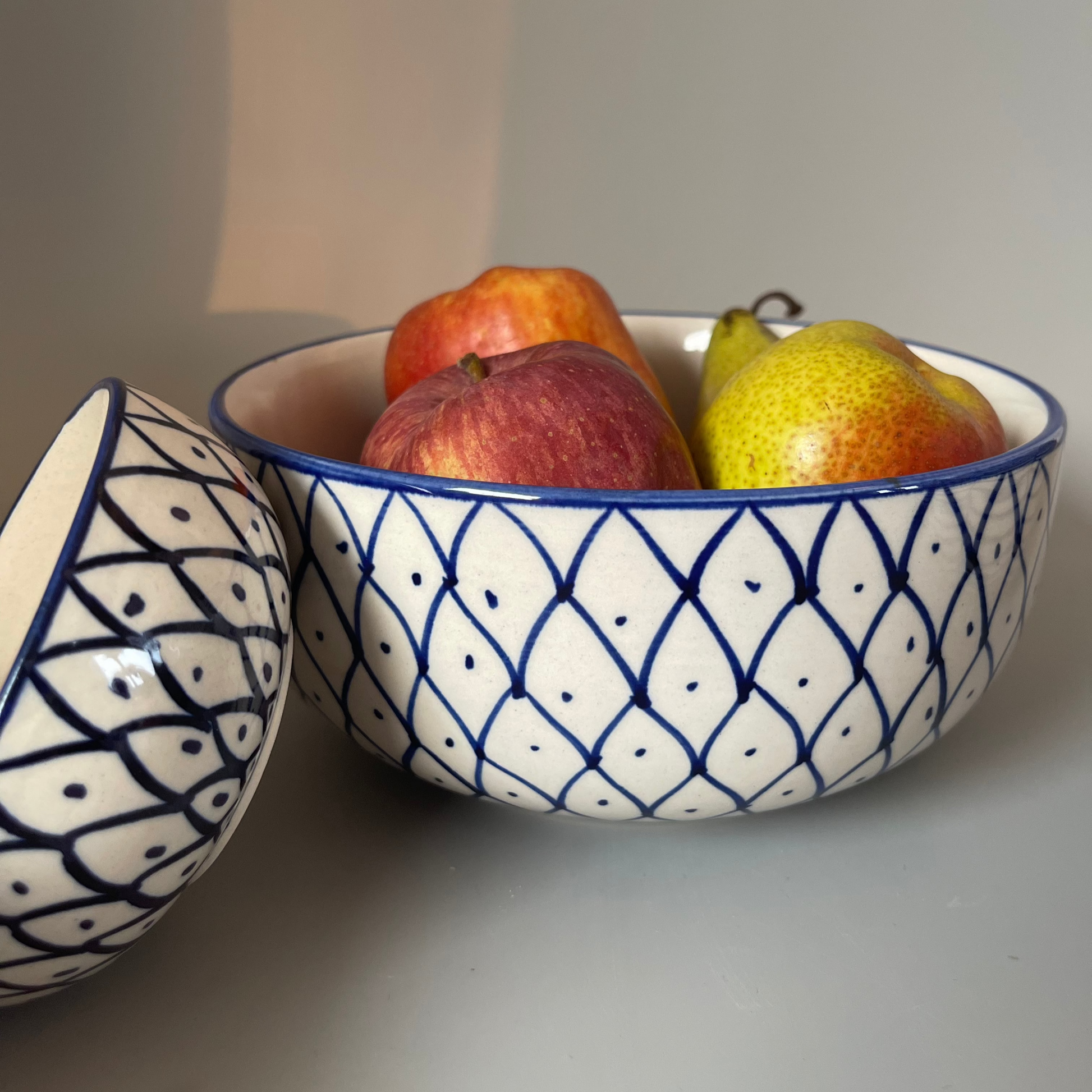 7.5 inch ceramic bowls with tribal-inspired leaf, fish, and wave prints in earthy tones
