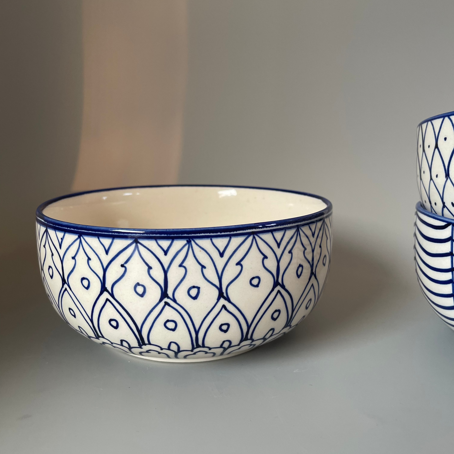 7.5 inch ceramic bowls with tribal-inspired leaf, fish, and wave prints in earthy tones