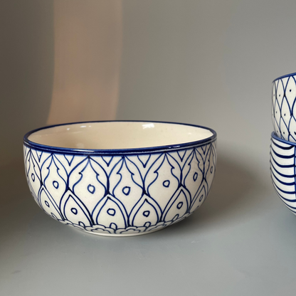 7.5 inch ceramic bowls with tribal-inspired leaf, fish, and wave prints in earthy tones