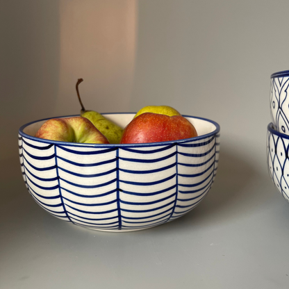7.5 inch ceramic bowls with tribal-inspired leaf, fish, and wave prints in earthy tones