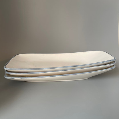 White ceramic platter with classic blue rim, ideal for serving snacks or desserts at casual or festive occasions